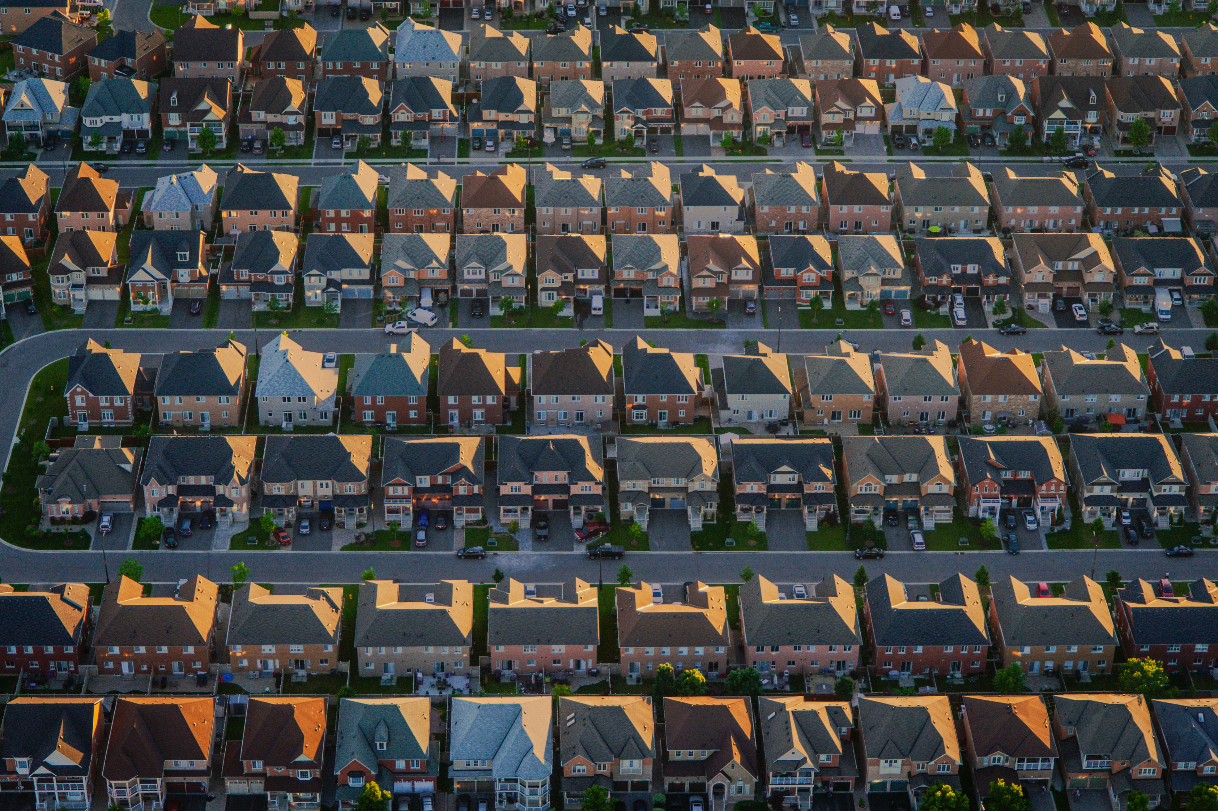 Aerial view of identical suburban houses in rows